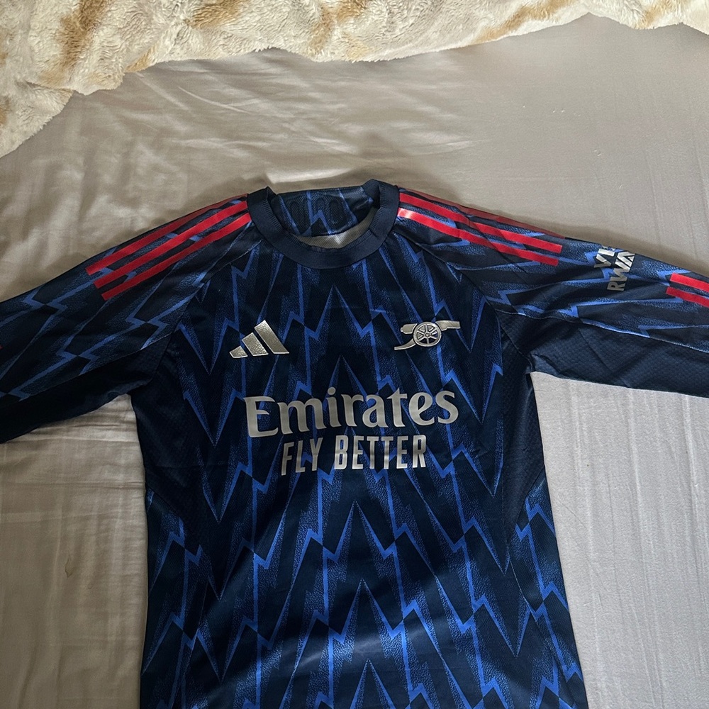 2025/26 Arsenal Adidas Blue and Red Zigzag Soccer Jersey